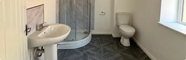 Renovated bathroom with new sink, shower and toilet