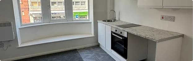 New kitchen with fitted worktop and cabinets