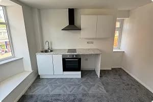 Completed kitchen with granite-effect worktop