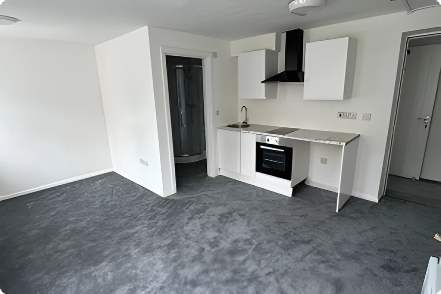 Refurbished room with new white kitchen units